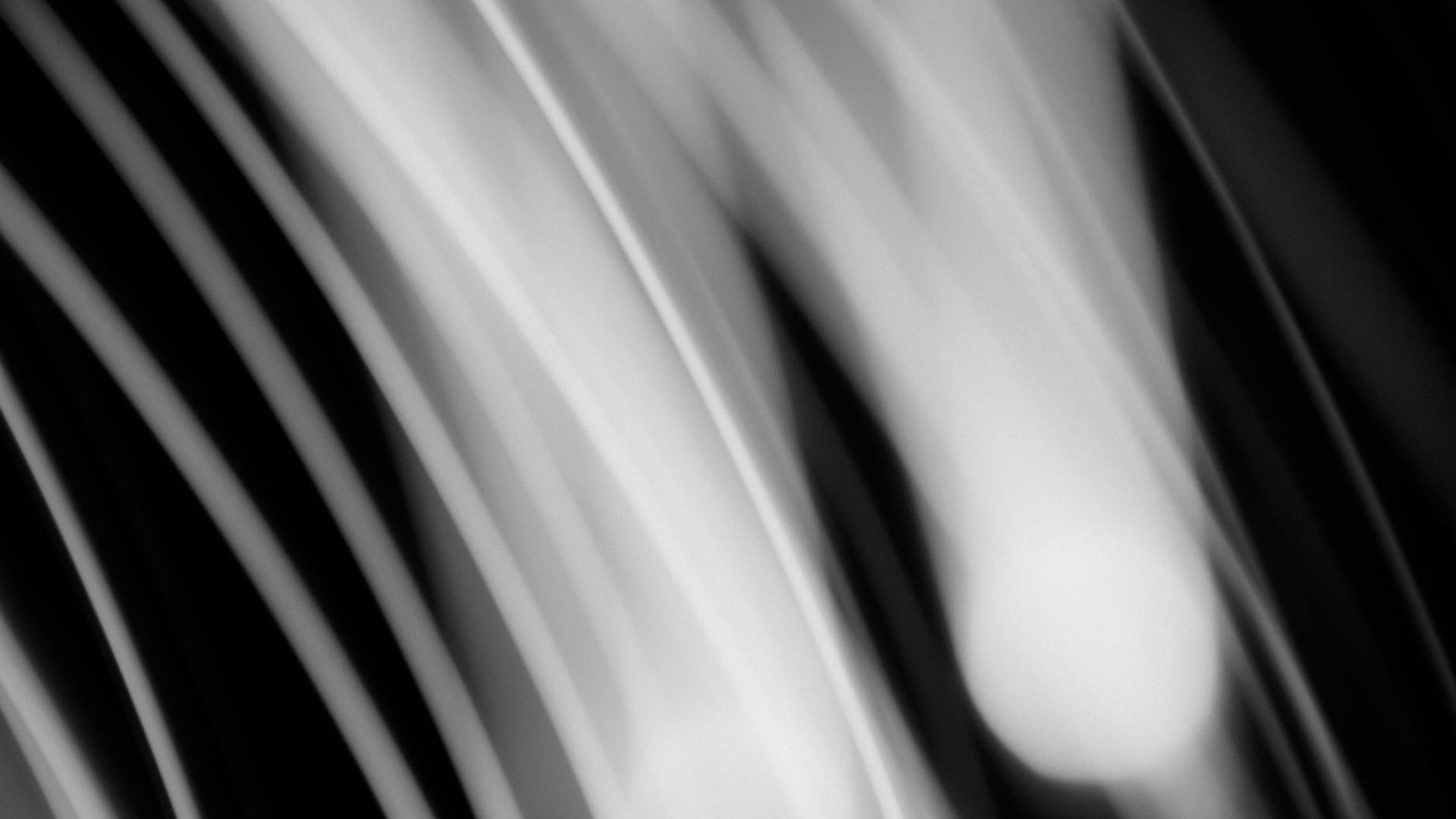 Abstract background with soft flowing lines suggesting movement.